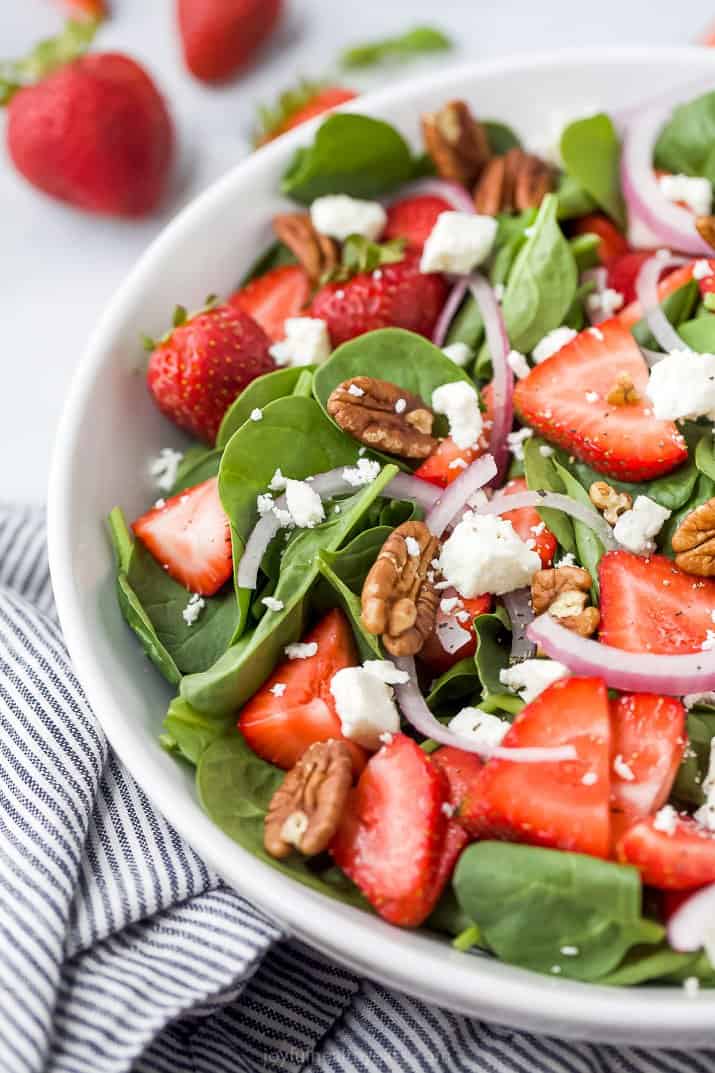 close up of strawberry spinach salad