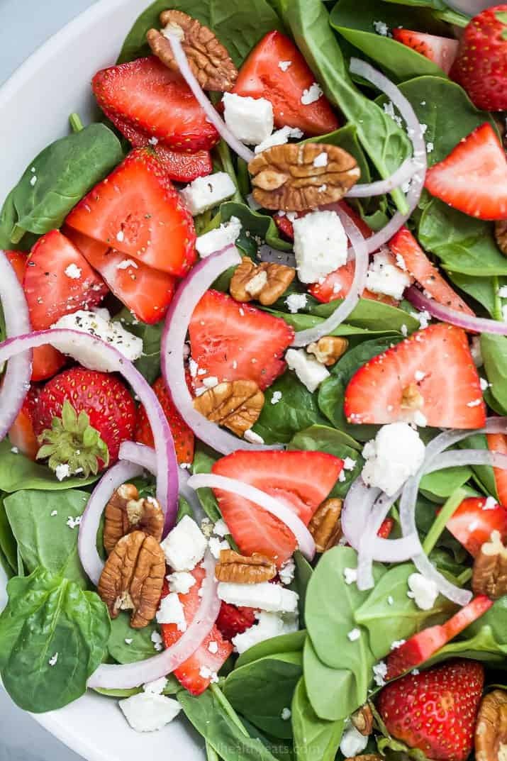 close up of strawberry spinach salad