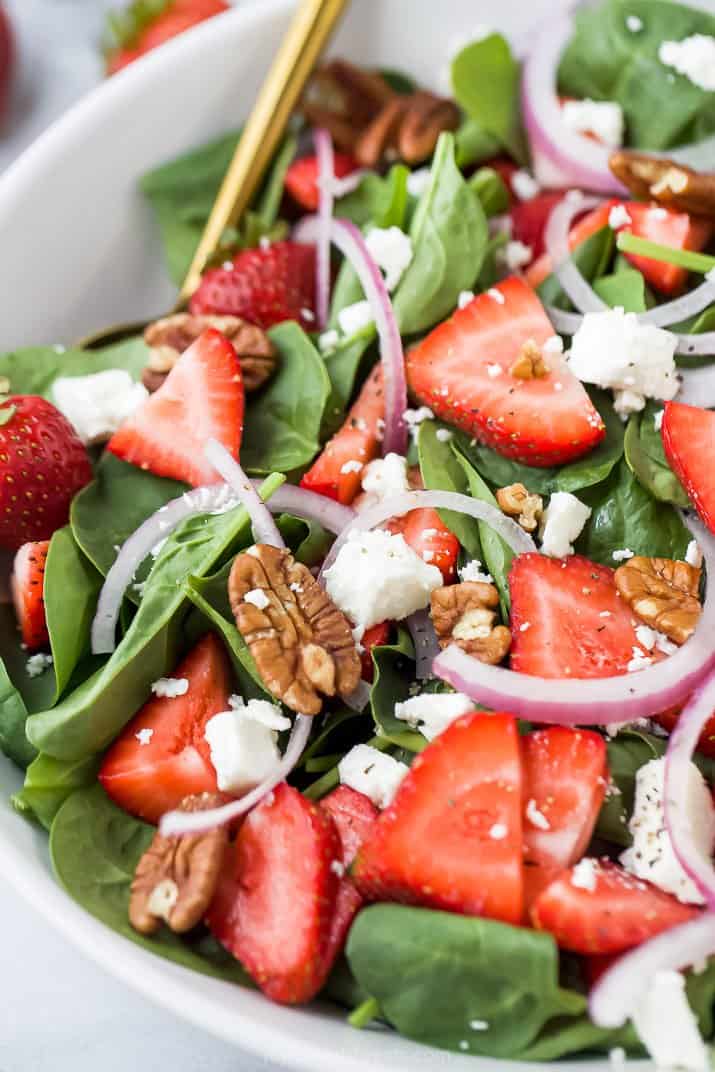 bowl filled with strawberry spinach salad