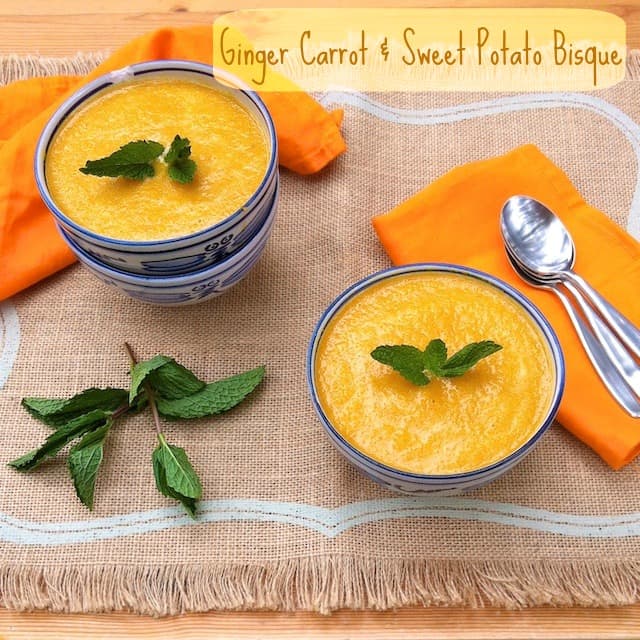 Title Image for Ginger Carrot and Sweet Potato Bisque with two bowls of bisque garnished with fresh herbs