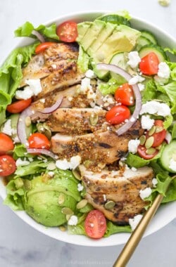 Bowl of chicken and avocado salad.
