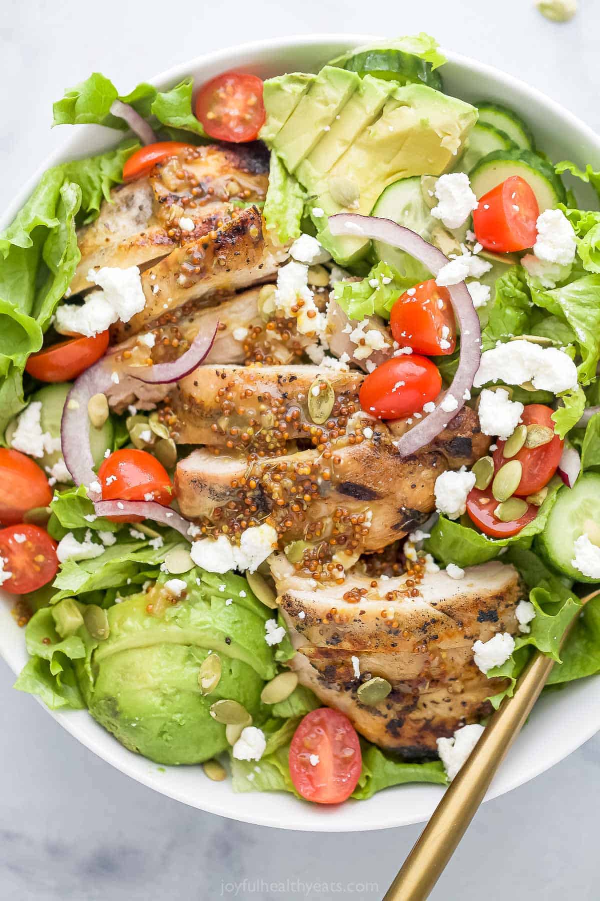 Bowl of chicken and avocado salad.