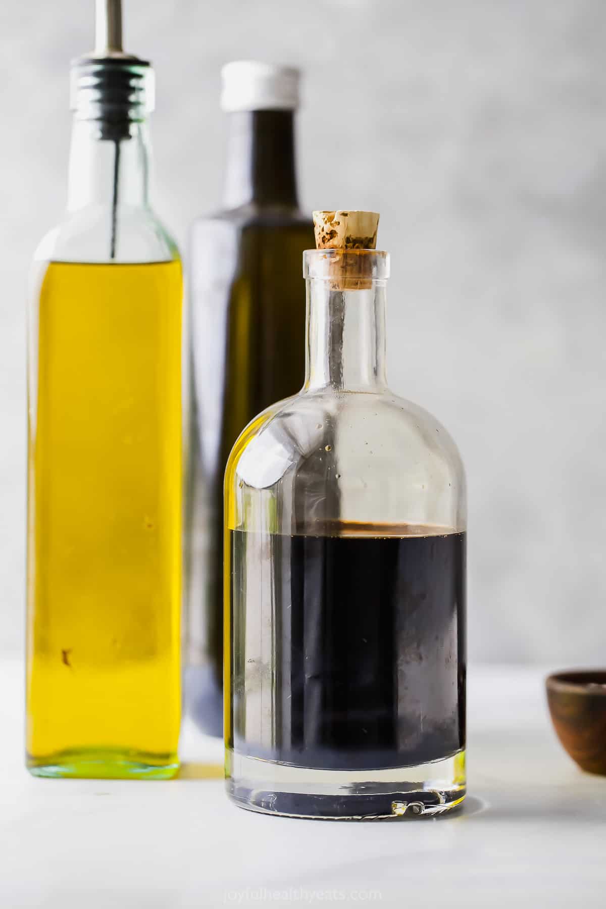 Bottles filled with balsamic vinegar and olive oil.