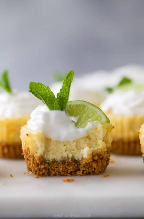Mini key lime pie bitten into to show layers