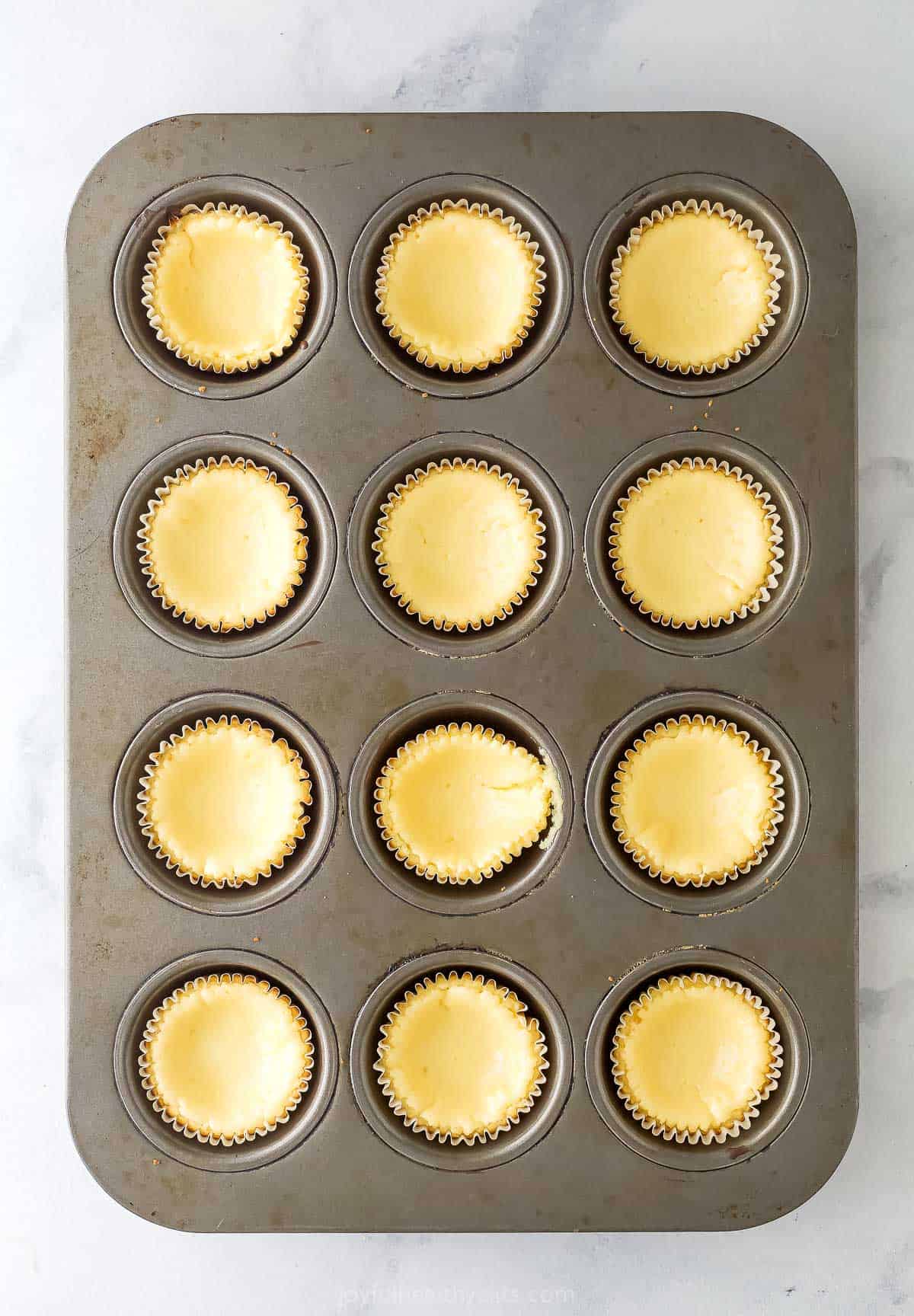Tart and sweet, creamy and fluffy, these mini key lime pies are a delightful one-bite dessert to whip up for parties—and just because. Overhead view of baked mini key lime pies