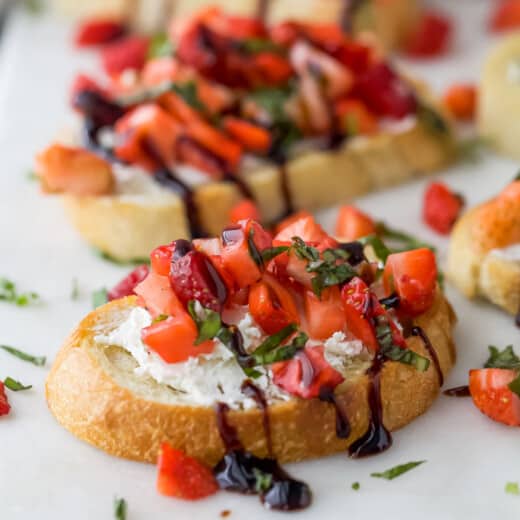Close-up of a bruschetta with balsamic reduction drizzle.