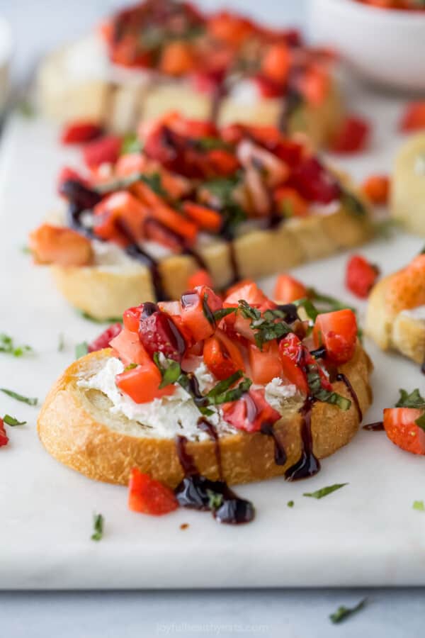 Close-up of a bruschetta with balsamic reduction drizzle.