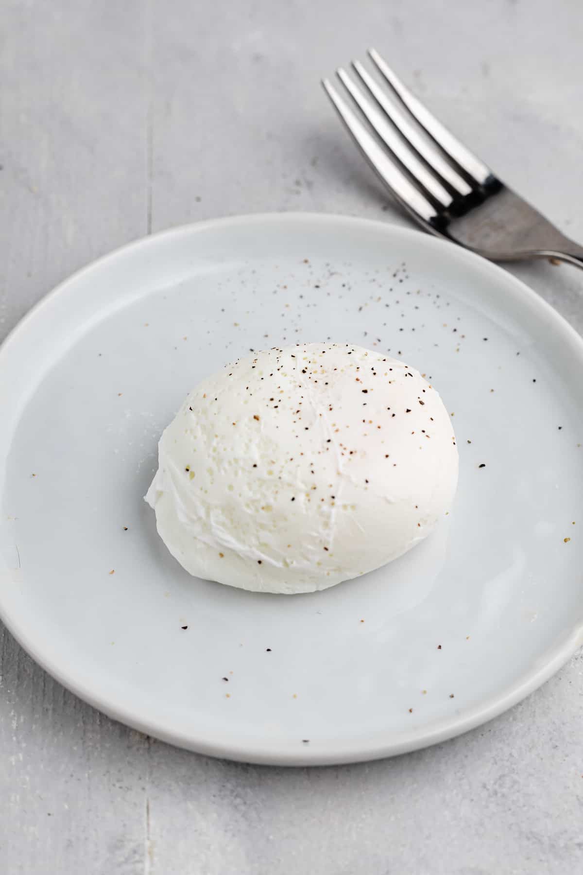 Poached egg on a white plate