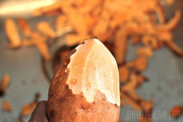 A partially-peeled sweet potato