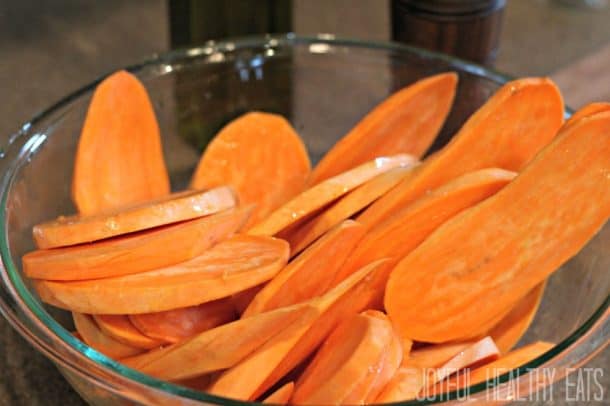 Sweet potato slices in a mixing bowl