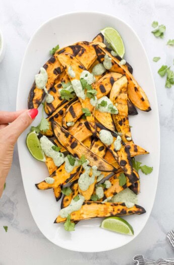 Sweet potatoes with cilantro lime crema on top.