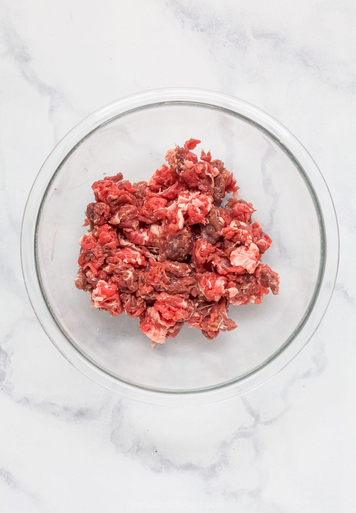 Skirt steak for the recipe in a bowl. 