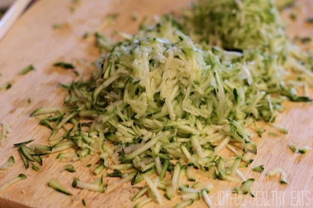 Shredded zucchini on a cutting board