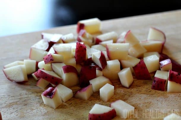 Diced red potatoes on a cutting board