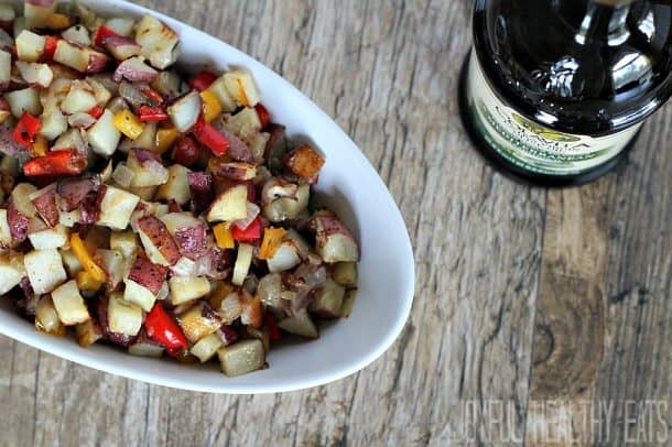 A serving bowl of roasted Breakfast Potatoes with bell pepper and onion