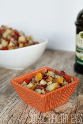 A bowl full of Easy Homemade Breakfast Potatoes with peppers and onions #breakfastrecipes #roastedpotatoes