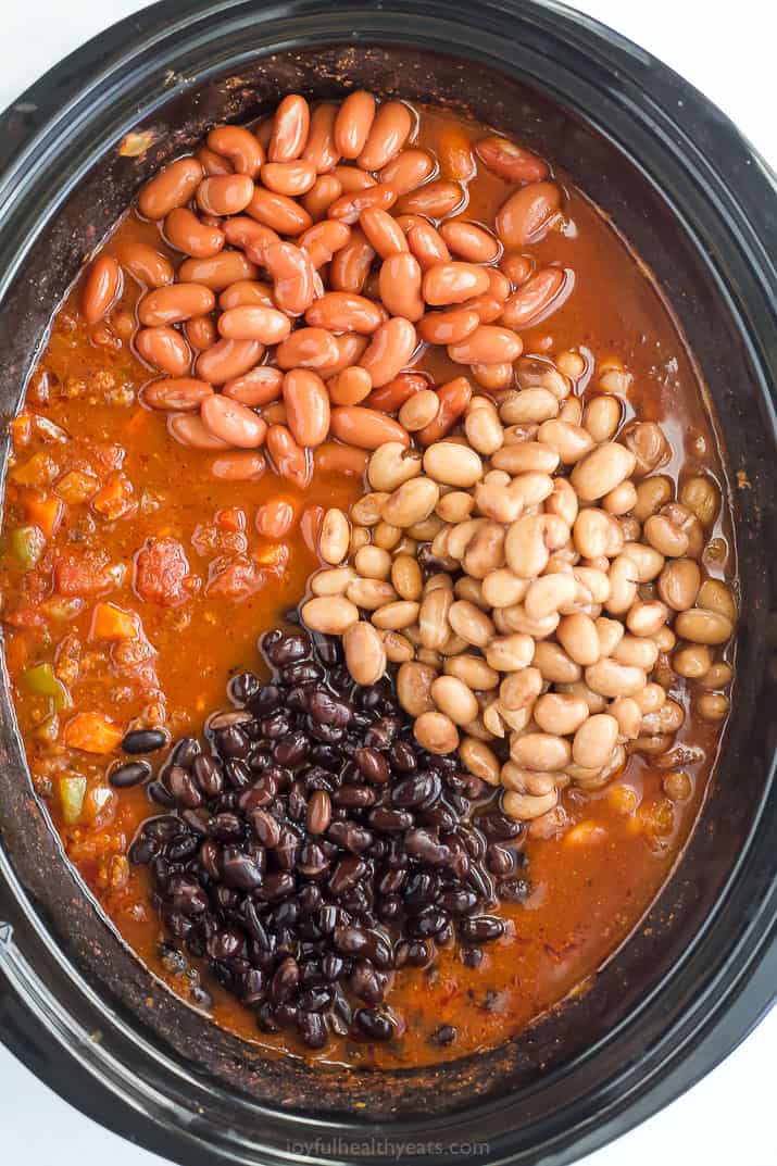 Beans in a crock pot of chili.