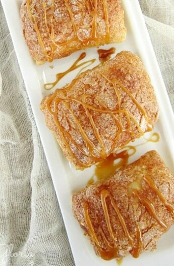 Three Pumpkin Caramel Empanadas on a White Serving Plate