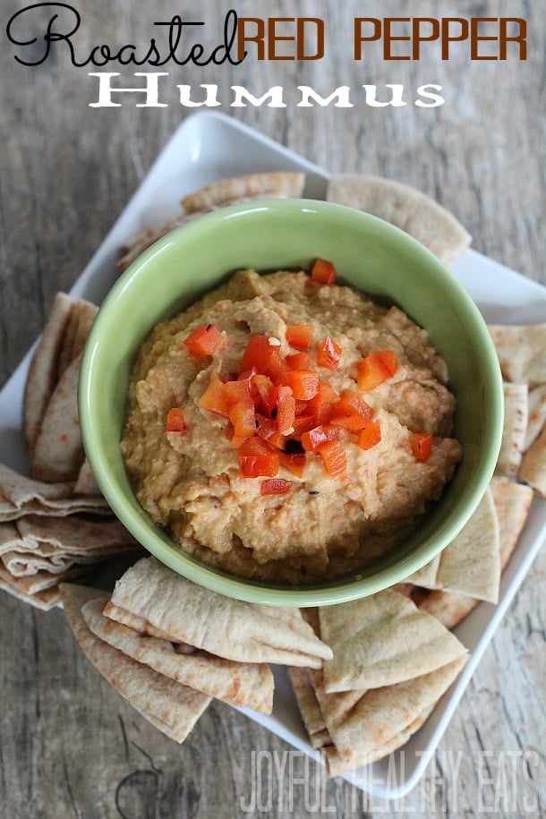 Green bowl of red pepper hummus