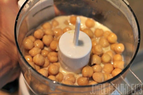 Adding chickpeas to the food processor