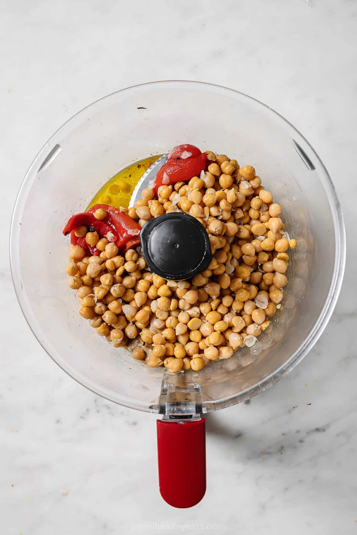 Adding all the ingredients to the food processor. 