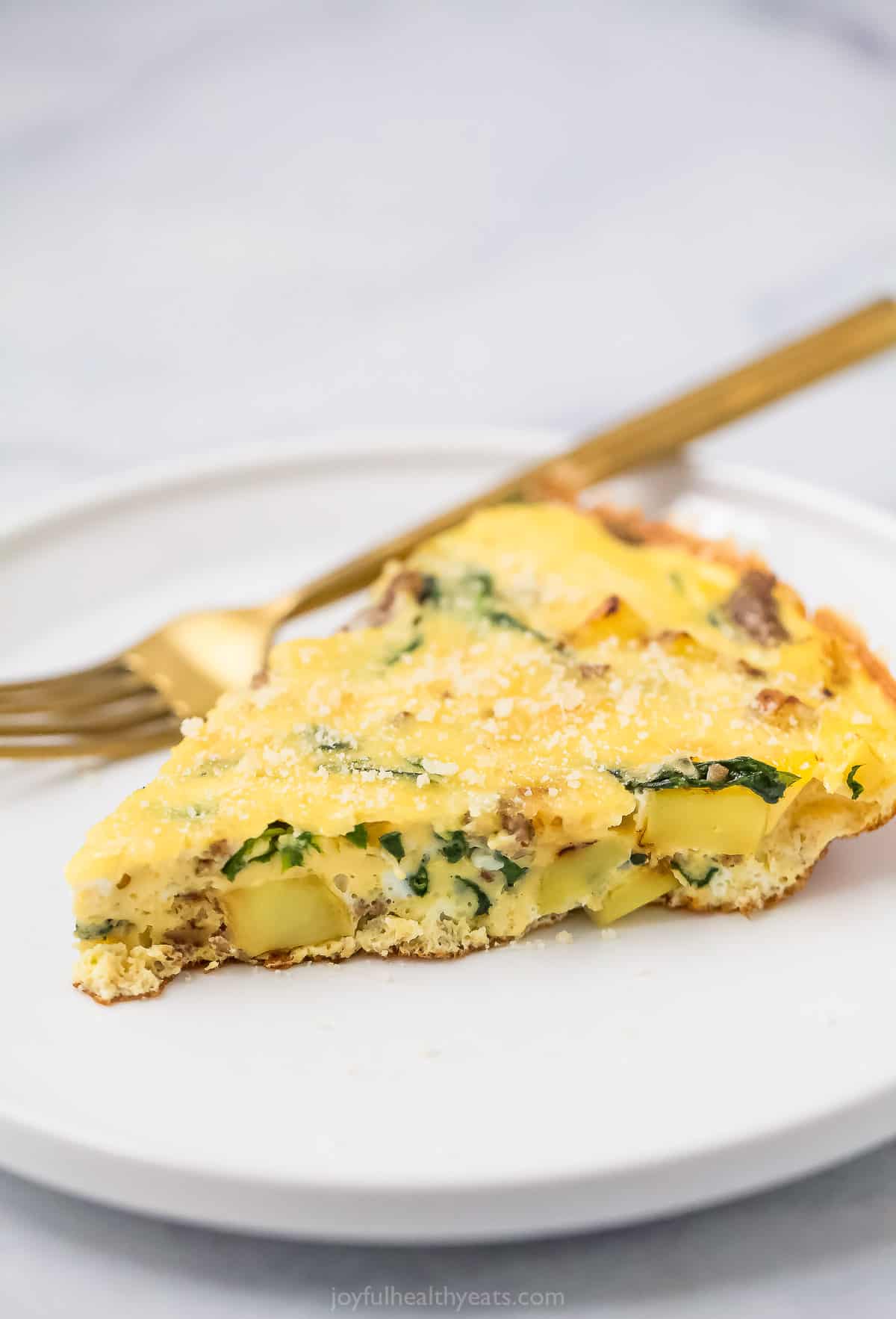 Potato frittata slice on a plate. 