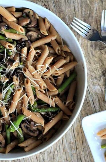 Asparagus & Mushroom Pasta in a bowl with goat cheese sauce.