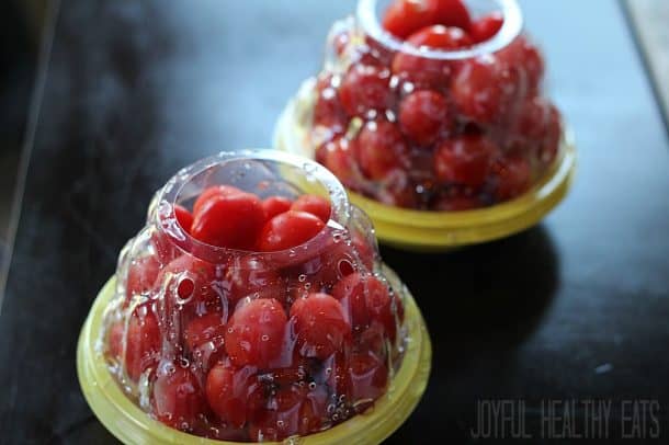 Two containers of grape tomatoes