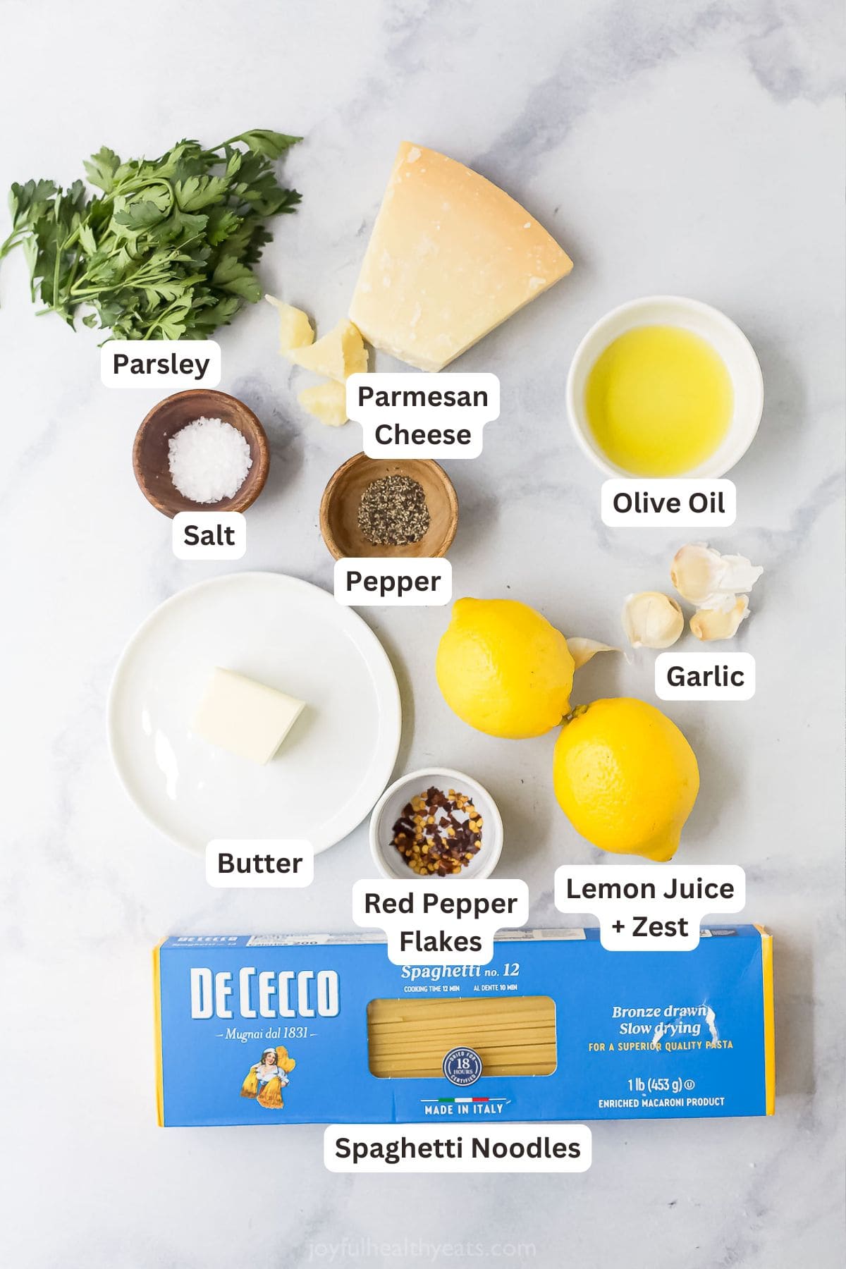 This Lemon Garlic Pasta is a 15-minute dinner elevated enough for a date night, but it's made with a short and simple list of ingredients! Overhead view of ingredients for creamy lemon garlic pasta
