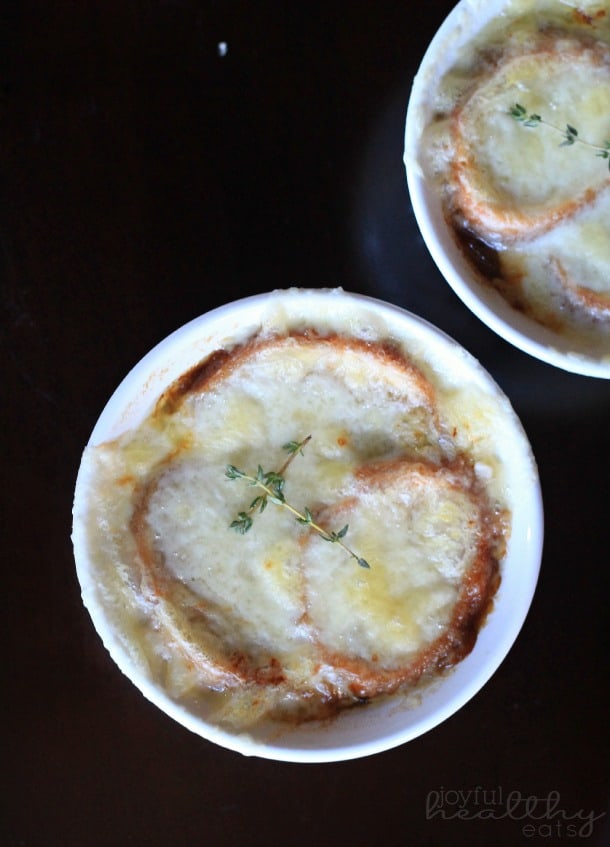 Top view of two ramekins of French Onion Soup