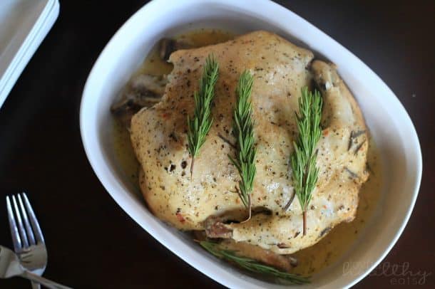 Top view of Garlic Herb Crock Pot Chicken in a baking dish