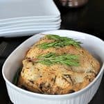 A Garlic Herb Crock Pot Chicken in a White Dish