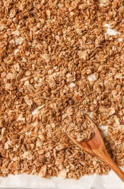 Overhead view of granola on pan with spoon