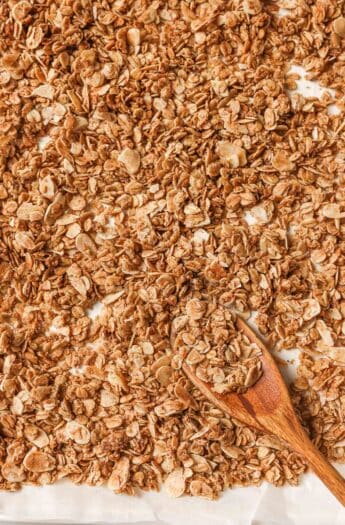 Overhead view of granola on pan with spoon