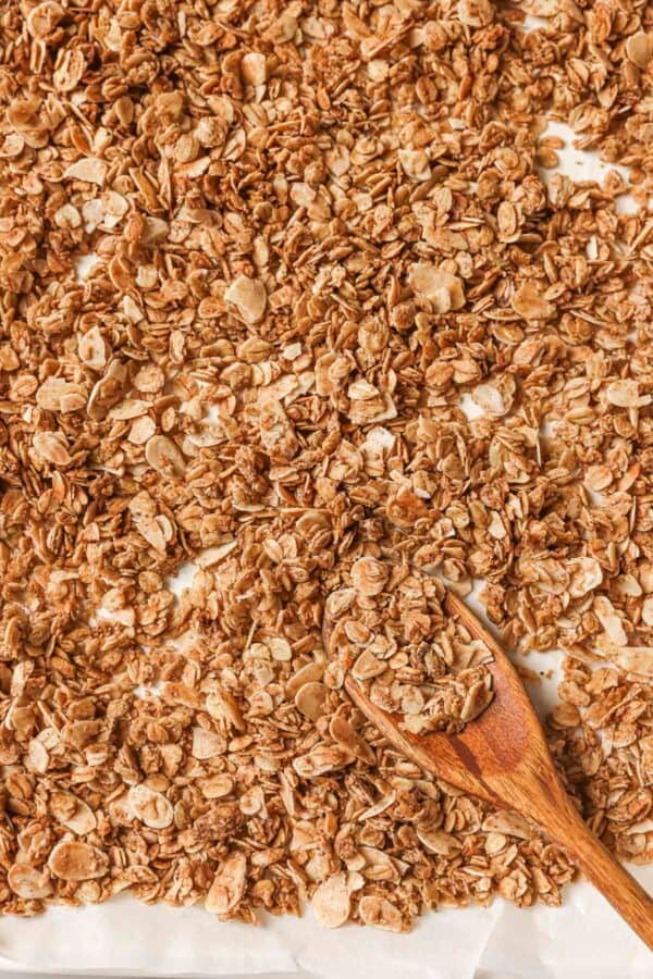 Overhead view of granola on pan with spoon