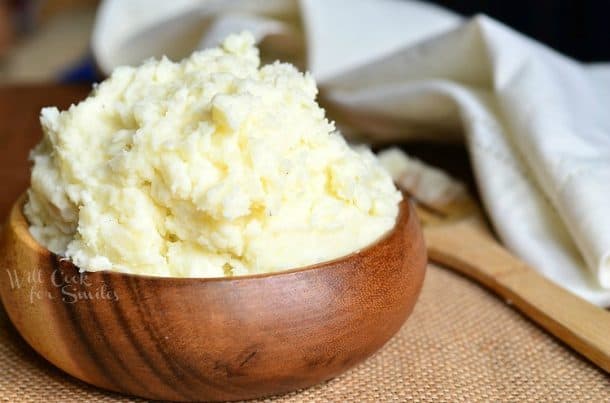 Wooden serving bowl of mashed potatoes