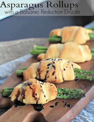 A Row of Asparagus Rollups Topped with Balsamic Reduction Drizzle
