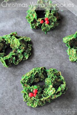 Christmas Wreath Cookies on a sheet of parchment paper.