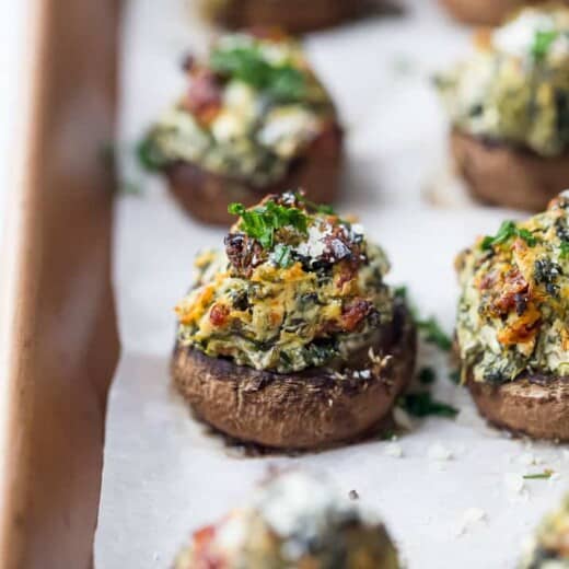 spinach stuffed mushrooms on a baking sheet