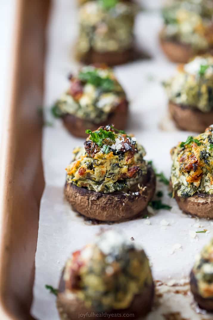 spinach stuffed mushrooms on a baking sheet