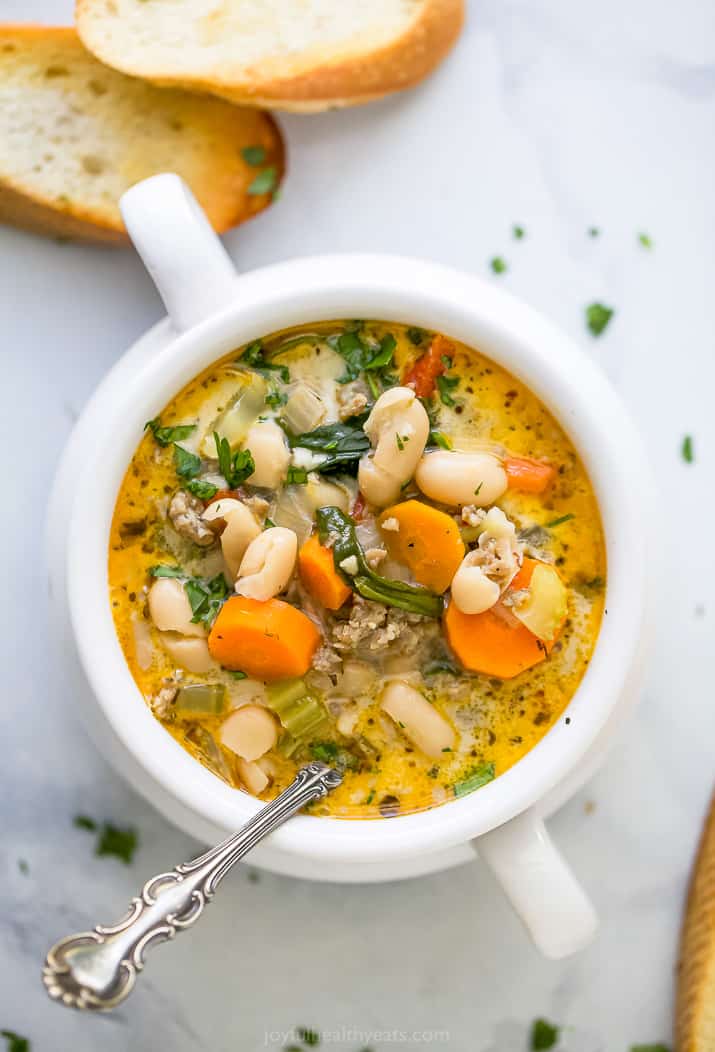 a bowl of soup filled with epic creamy tuscan white bean soup
