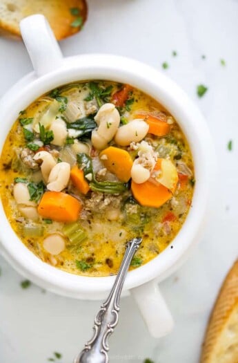 close up of a bowl filled with creamy tuscan white bean soup