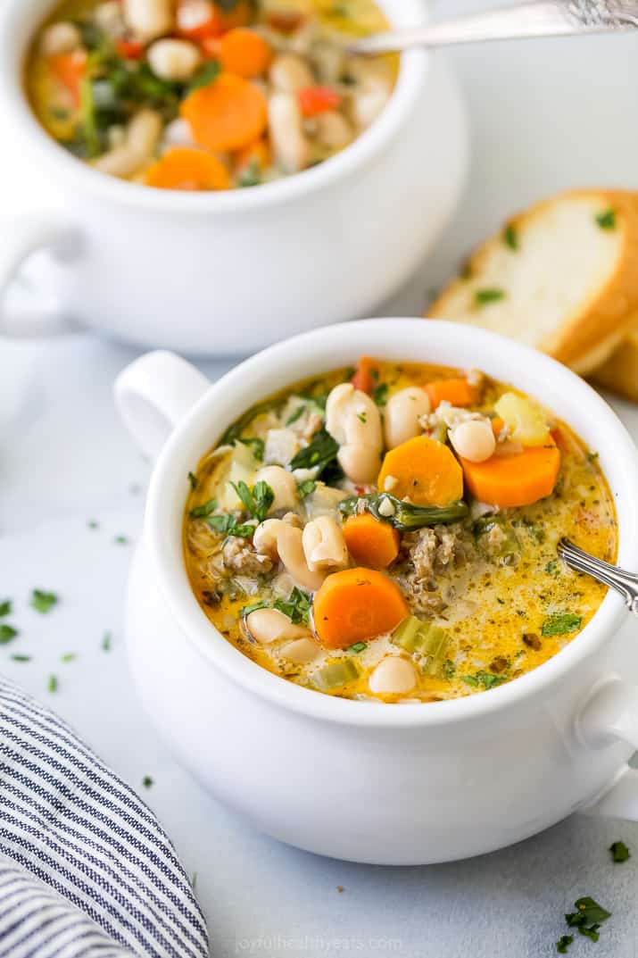 side closeup of a bowl filled with creamy tuscan white bean soup