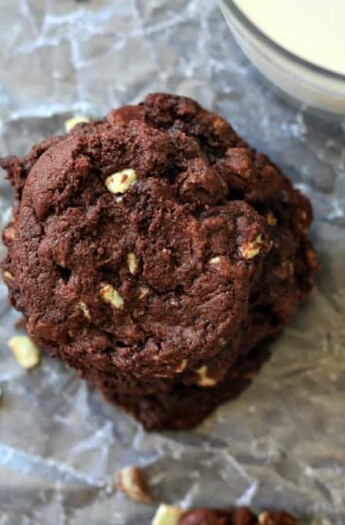 A Stack of Mint Dark Chocolate Chip Cookies Beside a Glass of Milk