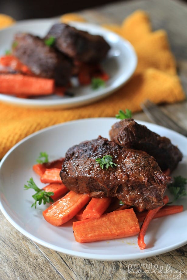 Balsamic Short Ribs on a White Plate Over Carrots