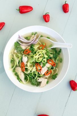 Top view of Chicken Pho Zucchini Noodle soup in a bowl