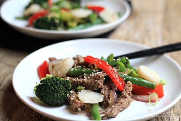 Fresh cooked Paleo Steak & Veggie Stirfry on a white plate