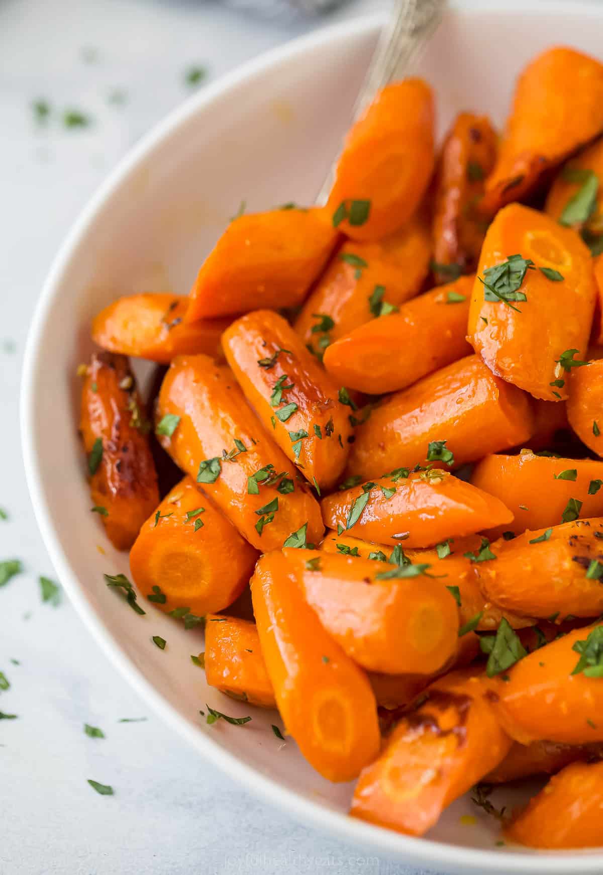 a bowl of honey glazed carrots