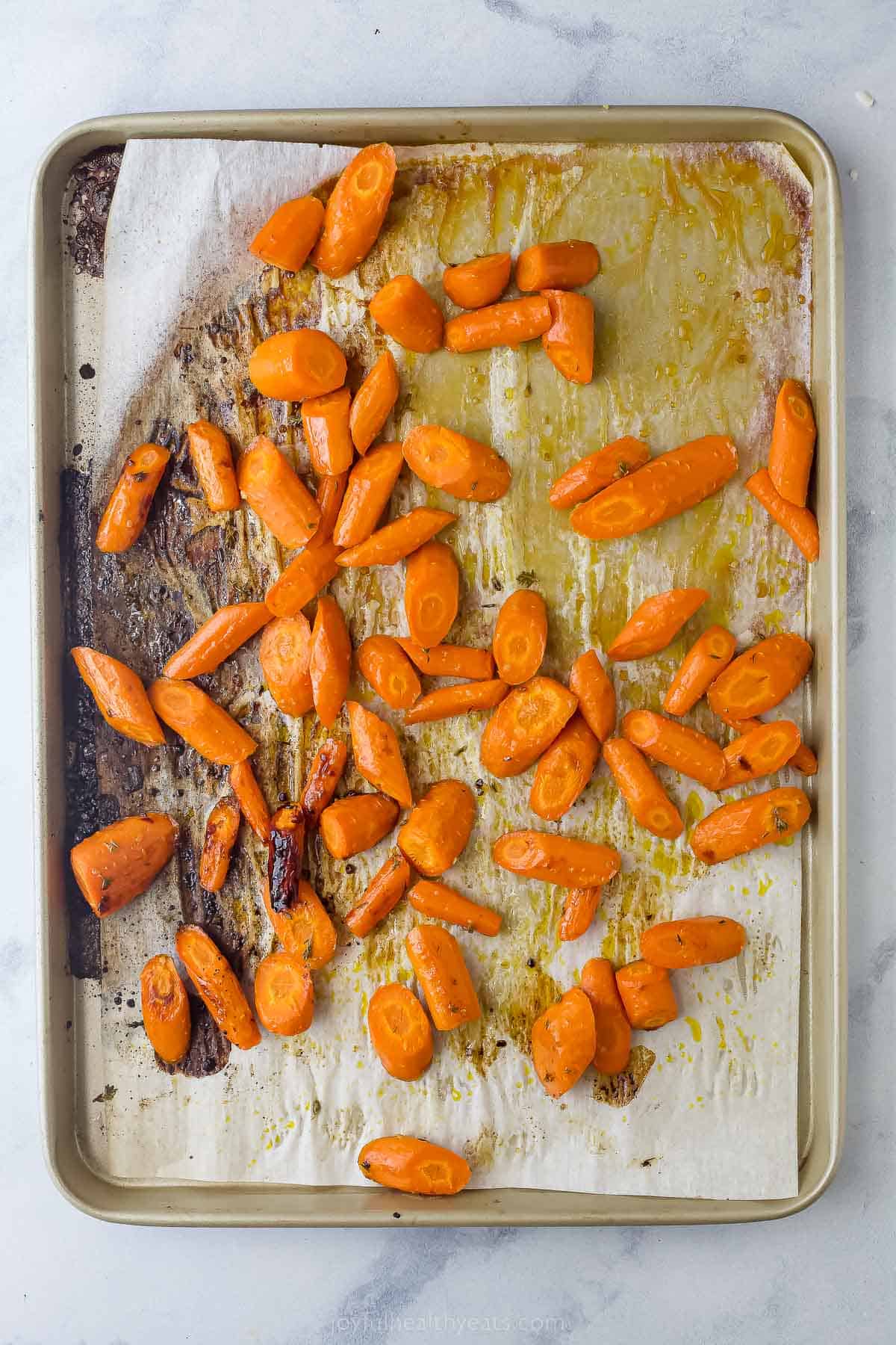 honey glazed carrots on a sheet tray