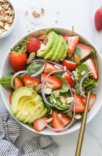 Bowl of strawberry spinach salad.